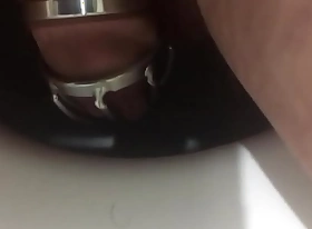 Another peeing in the metal chastity cage. Video report for my mistress who locked me in this chastity belt till the weekend.